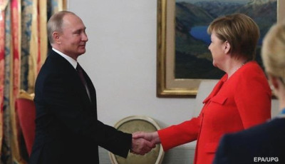 Путин и Меркель обсуждают мигрантов два дня подряд